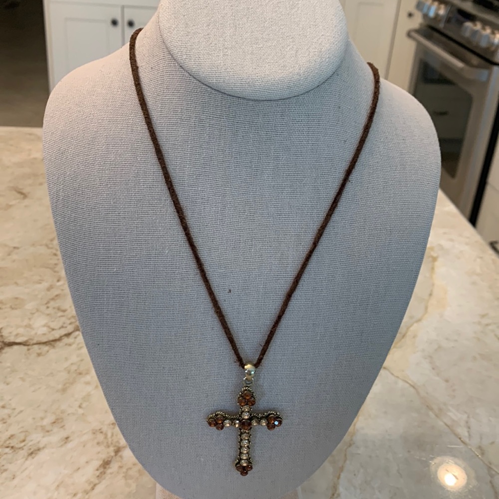 1772 crystal-like studded cross with leather strap. Gently worn strap.